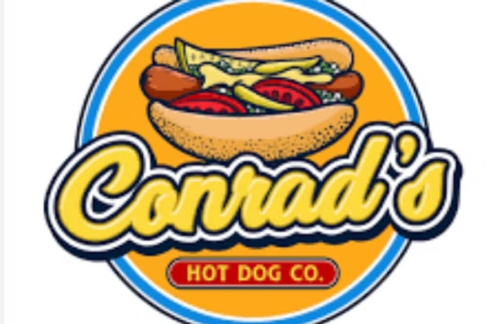 Logo of Conrad's Hot Dog Co. featuring a hot dog with toppings on a bright orange background.